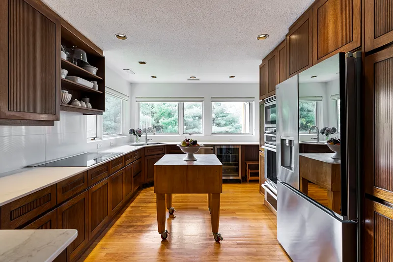 Chef's kitchen featuring solid wood cabinetry and plentiful storage