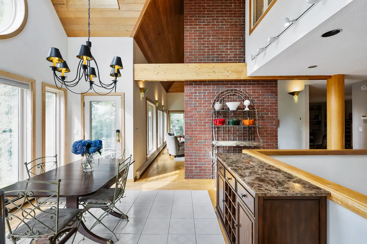 Capture the inviting perspective from one of the kitchen entrances, highlighting the seamless flow and open layout of the home